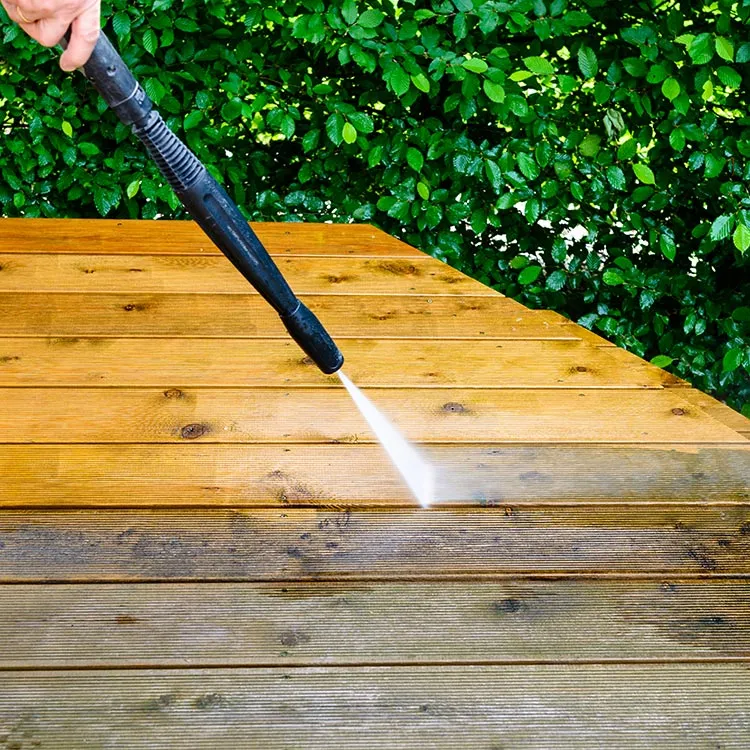 Pressure washer cleaning a timber deck, cleaning equipment in Bowen