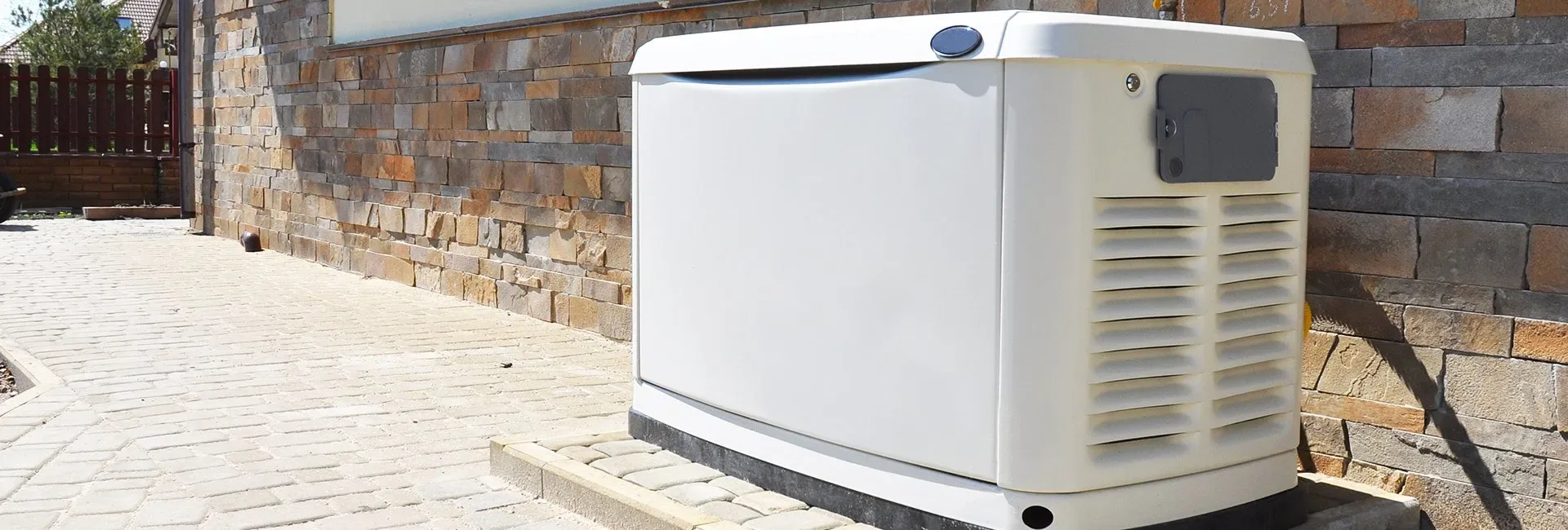 Commercial standby generator installed outside a home, available in Bowen